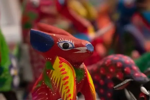 This Alebrije was handcrafted in Santa Fe, New Mexico and was made to look like a brightly colored dog.