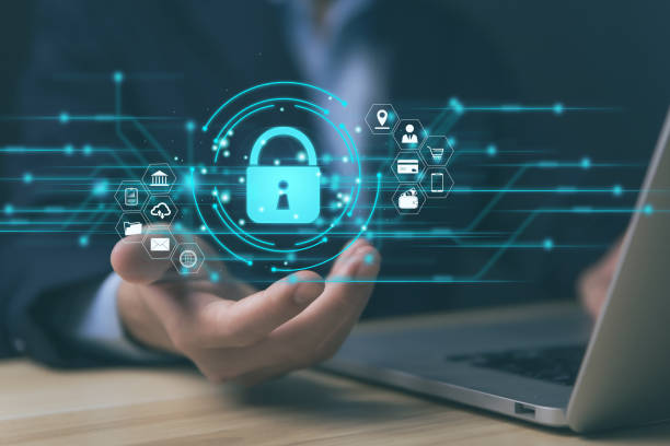 istock Businessman using laptop and hand showing lock icon and other internet network security website connection 1454095876