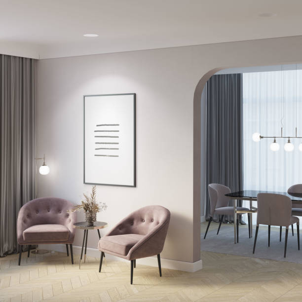 istock Elegant interior with an illuminated vertical poster next to an archway to a dining room, flowers in a vase on a coffee table between two elegant chairs, and a floor lamp near gray curtains. 1454097588