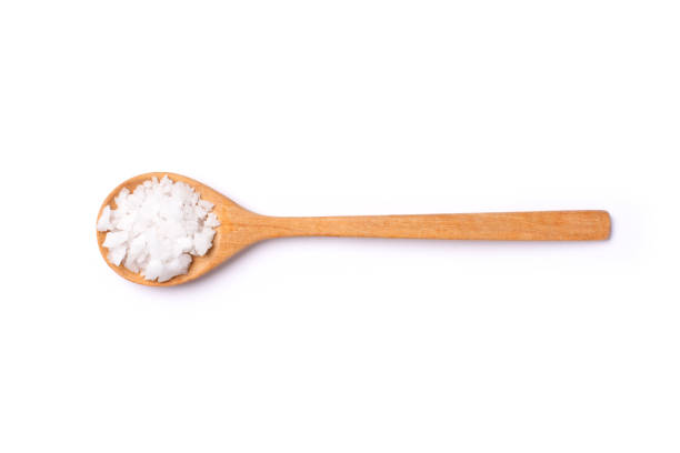 istock natural sea salt in wooden spoon 1454097641