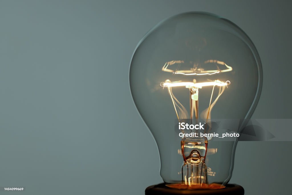 Close up glowing light bulb Lightbulb Close-up and Copy space Art Stock Photo