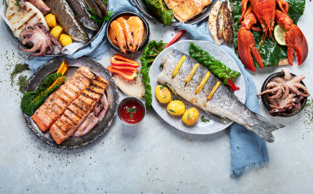 istock Various of seafood platter - prawn shrimp, squid, octopus mini, salmon, lobster. 1454100689