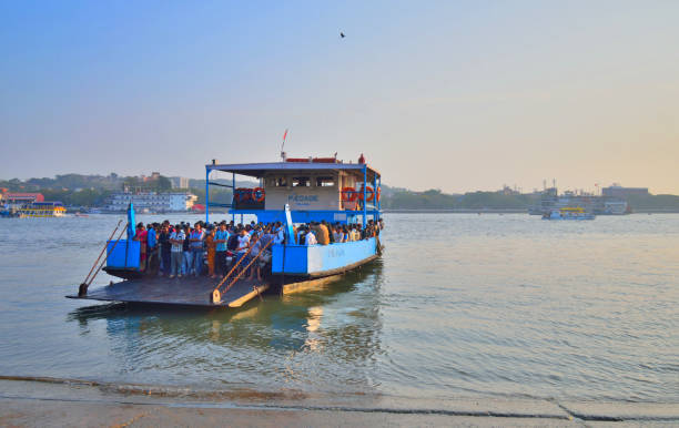 Goa, India - January 24, 2019: People getting on a public ferry over Mandovi river.