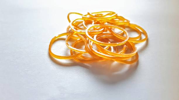 elastico giallo elastico - flexibility rubber rubber band tangled foto e immagini stock