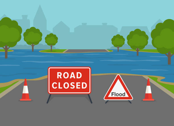 경고 표지판과 원뿔이있는 침수 된 도시 도로. 영국 폐쇄 도로 표지판입니다. - cyclone fence stock illustrations