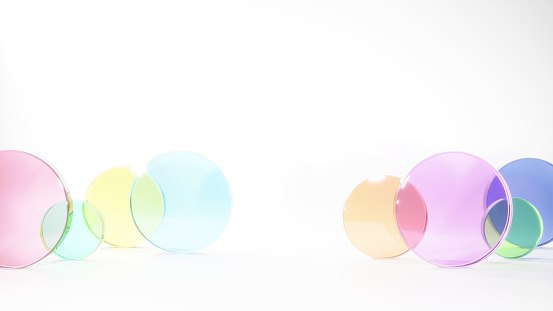 3D Illustration.Image of several colorful circular glass pieces on a white background. Product space (horizontal)