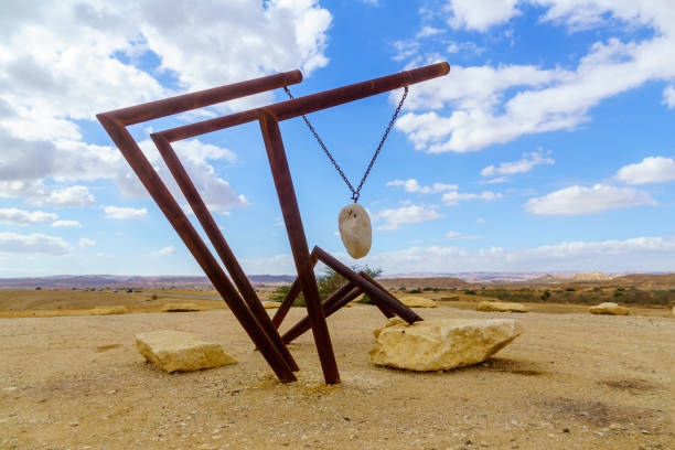 Ein Yahav, Israel - January 14, 2022: Winter view of a sculpture and desert landscape, in the Arava valley, southern Israel