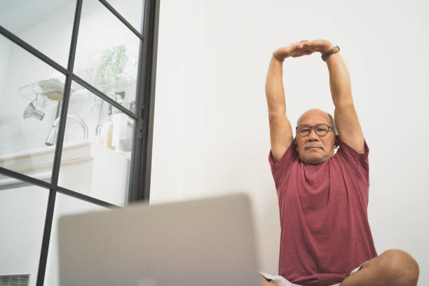 istock Asian Senior man stretching his arms 1454109604