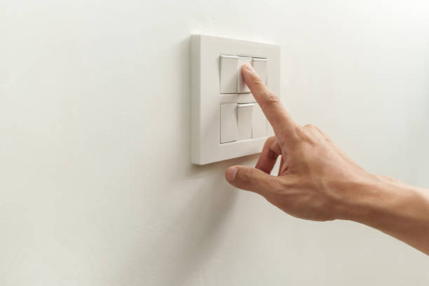 istock Closeup of finger is turning off on lighting switch 1454109699