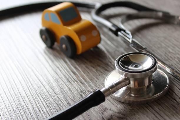 istock Toy car and stethoscope. 1454110651