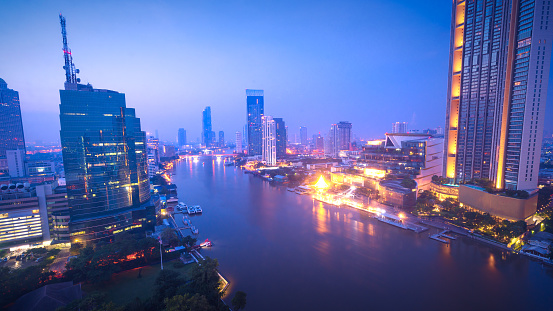 Aerial view Bangkok city skyline at night over Chao Praya River