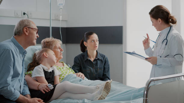istock General practitioner talking to ill patient and 1454113243