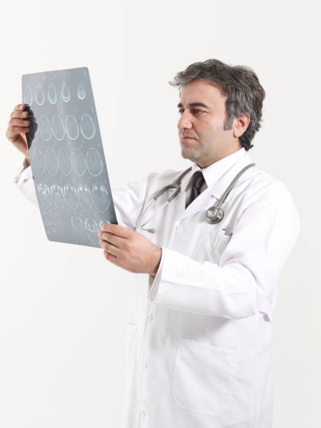 istock Doctor looks at brain scan images 1454115288