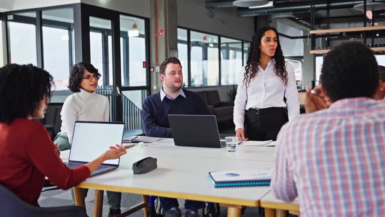 Handsome Mixed Race People Brainstorming In A Corporate Office