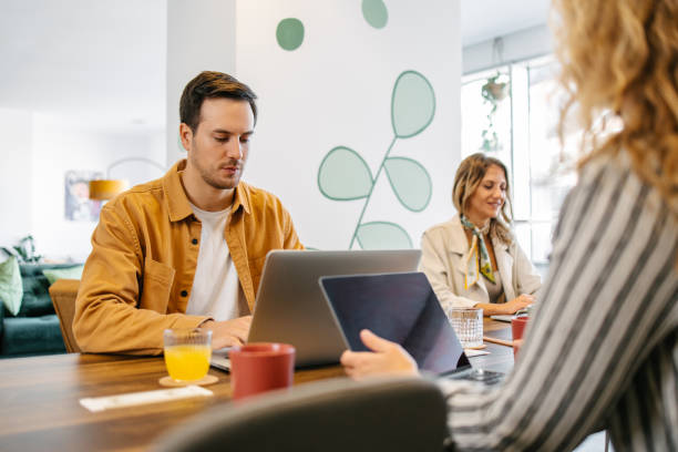istock People working together in the office 1454118334