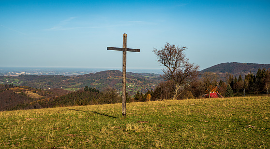Loucka hill with wooden cross and meadow in autumn Slezske Beskydy mountains in Czech republic
