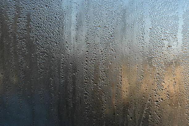 istock water dew on the window glass. condensate 1454120714