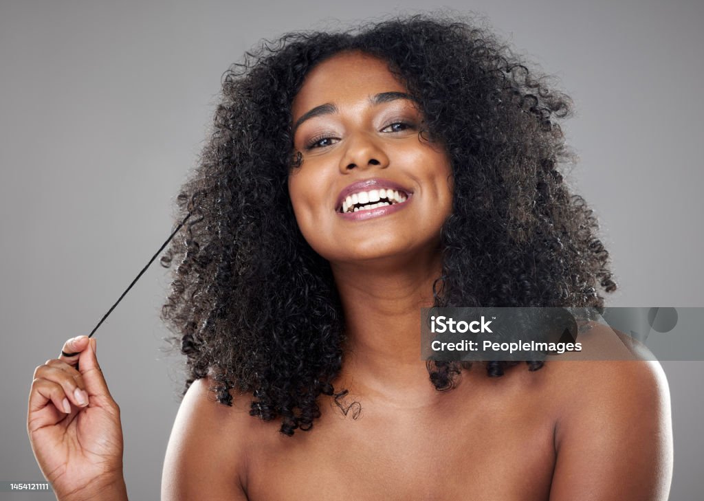 Beauty, hair and black woman in a studio with mockup for wellness, skincare and health while grooming against grey background. Portrait, model and cosmetic, hair care and clear skin, relax aesthetic Women Stock Photo