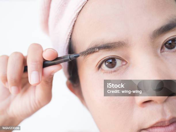 Woman Draw Eyebrows Eyebrow Brush Close Up Stock Photo - Download Image Now - Eyebrow, Mature Women, 45-49 Years