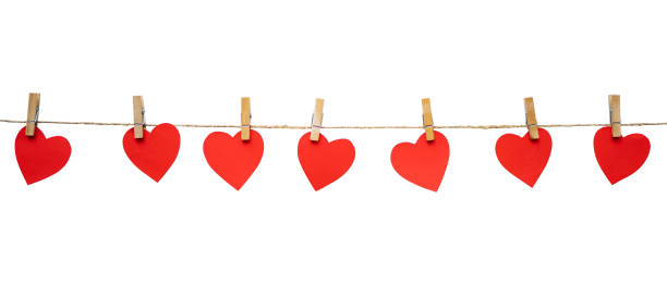 istock Love paper shape hanging on a rope for romantic background design 1454126115