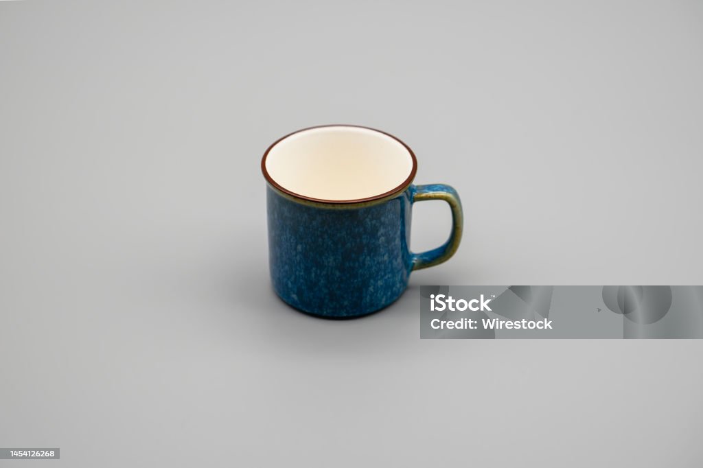 Horizontal shot of a espresso cup. A horizontal shot of a espresso cup with grey background. Beauty Stock Photo