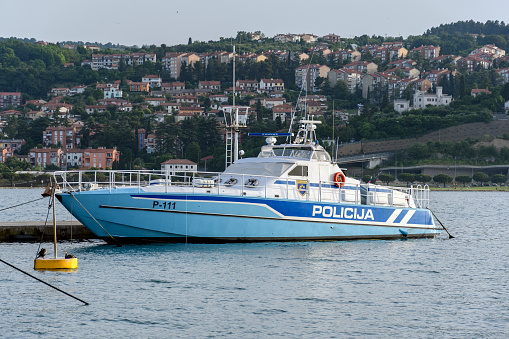 Koper, Slovenia – June 09, 2021: The Slovenian police boat P-111 tethered to dock in the city of Koper in Slovenia.