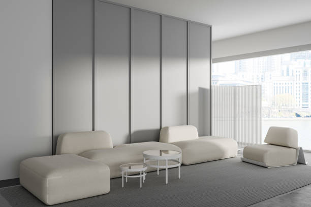 istock Corner view on bright living room interior with sofa, armchair 1454126401