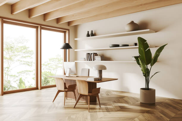 istock Light business interior with desk and pc computer, shelf with panoramic window 1454126628