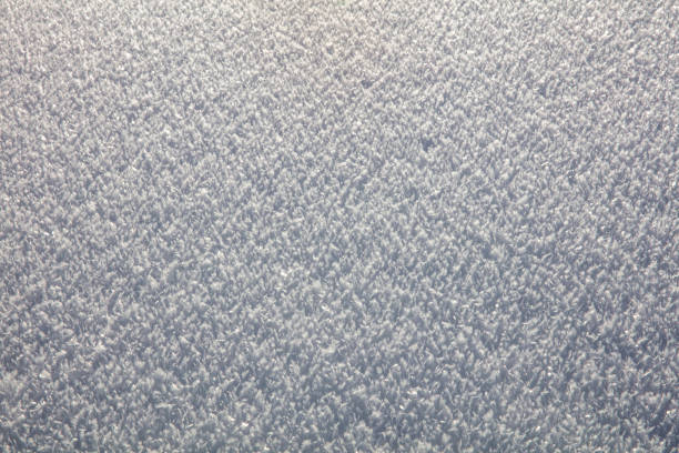 fresh white sunlit snow and ice crystal background