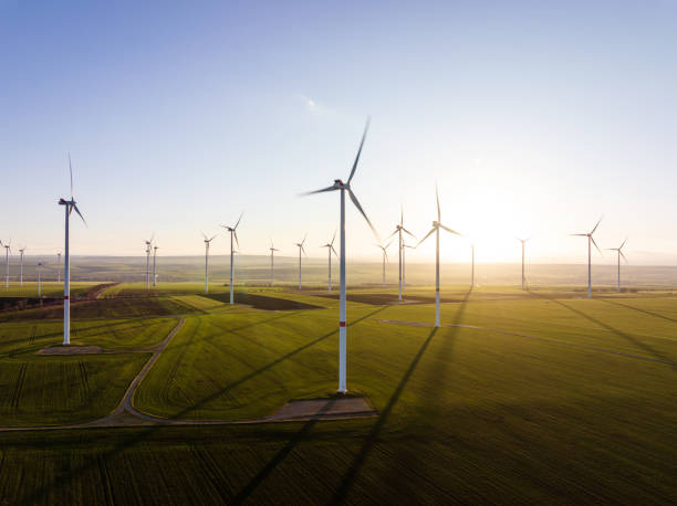 istock Aerial view of wind turbines in evening light 1454127788