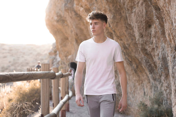 A young blonde Spanish hiker climbing the mountain