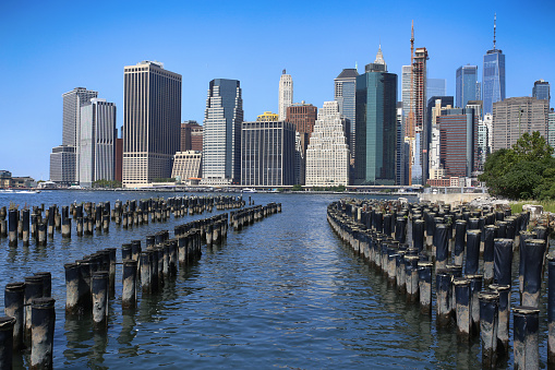 An aerial view of Manhattan Skyline with wooden logs from Brooklyn Bridge Park, New York City