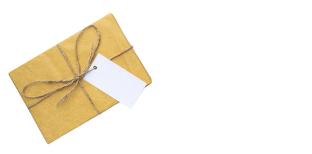istock Vintage gift box with rope and blank card. Minimalist retro background and copy space 1454130995
