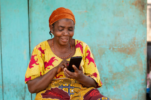 istock Beautiful elderly African woman using her smartphone 1454131694