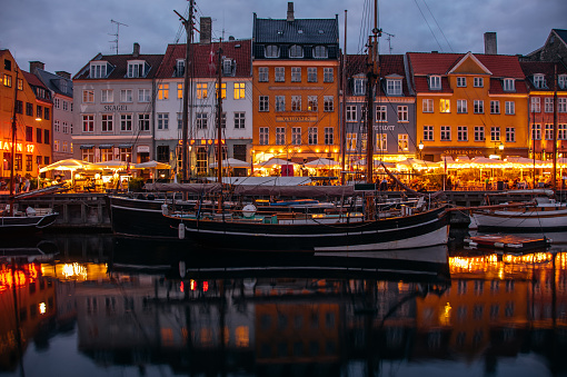Copenhagen, Denmark – September 05, 2021: An evening in the Nyhavn Quarter in Copenhagen, Denmark