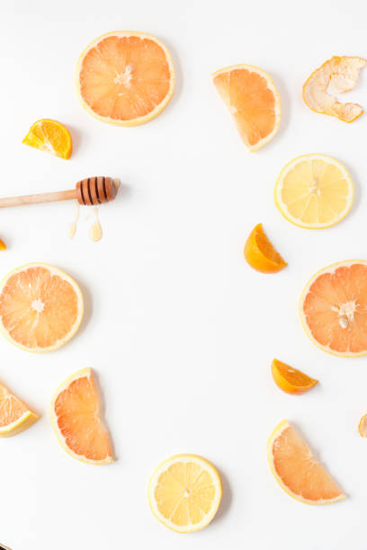 istock Flat lay of citrus and honey on isolated white background 1454131817