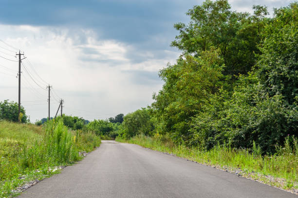 istock Beautiful empty asphalt road in countryside on colored background 1454132574