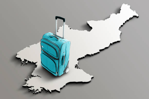 Blue suitcase on blank 3d map of North Korea. Copy space. No people. Horizontal orientation.