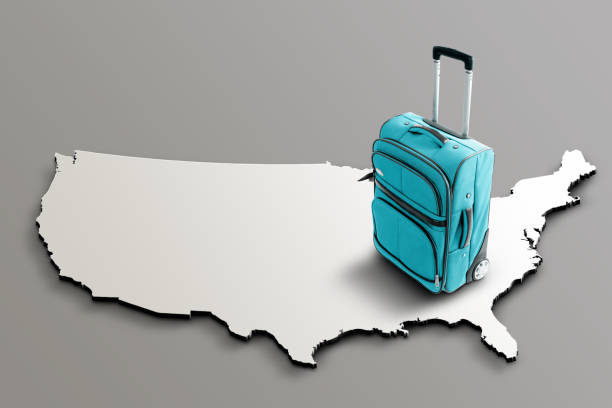 Blue suitcase on blank 3d map of United States. Copy space. No people. Horizontal orientation.