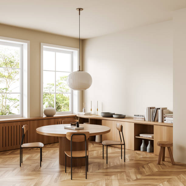 istock Light living room interior with table and chairs, dresser and window. Empty wall 1454133774