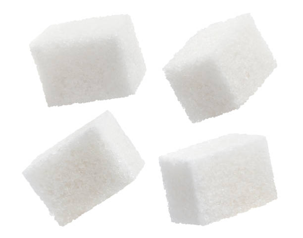 istock Set of white sugar cubes on white 1454134103