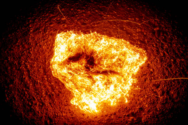 istock Closeup of a burning hot fire on an asphalt 1454135348