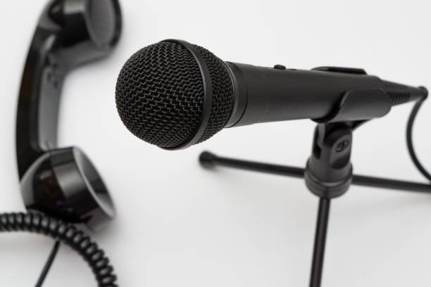 istock microphone and antique telephone 1454136393