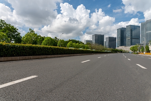 Empty street in downtown of a modern city with office buildings