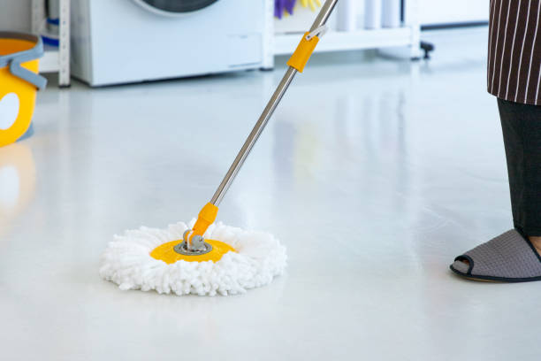 istock woman using mop to clean floor, close-up 1454139022