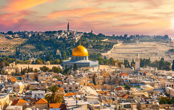 Colorful, sunset sky and an aerial view of the Arabic quarter of Jerusalem A Colorful, sunset sky and an aerial view of the arabic quarter of Jerusalem place of worship stock pictures, royalty-free photos & images