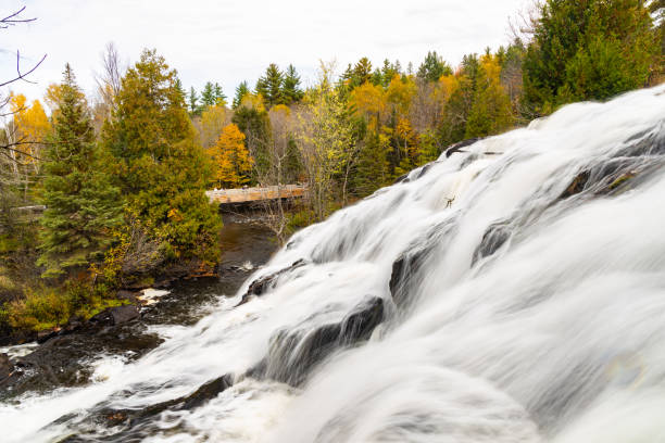 istock Waterfall in a forest in the fall colors 1454140251