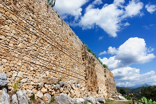 View of part of the wall of Morella, Castellón, Spain, with the Torres de Sant Miquel and the top of a church tower above the wall