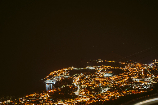 An aerial view of an illuminated city at night