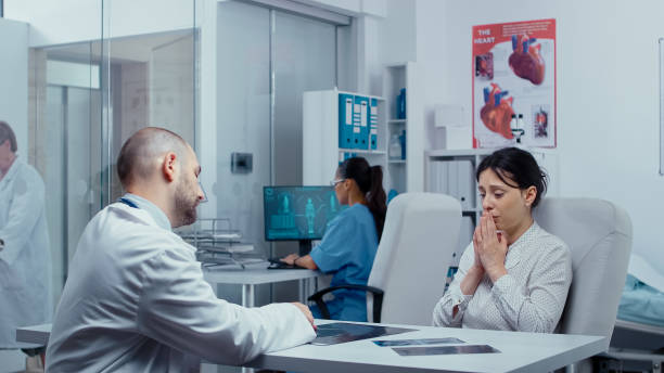 istock Sadness and despair at doctor office 1454144206